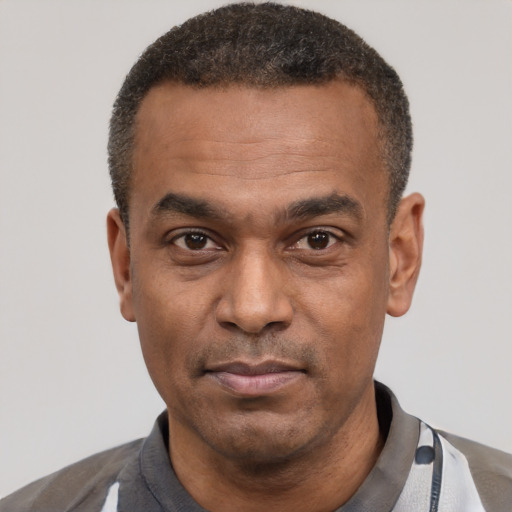 Neutral latino adult male with short  black hair and brown eyes