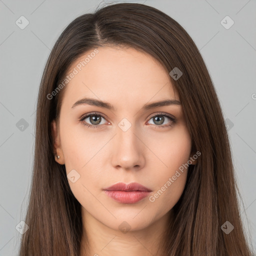 Neutral white young-adult female with long  brown hair and brown eyes