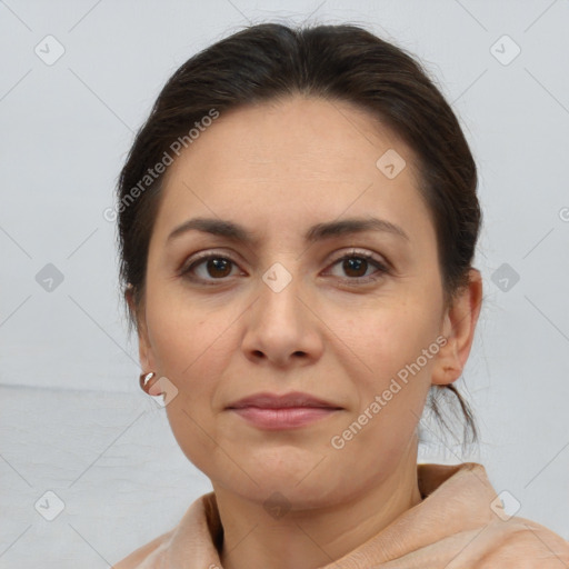 Joyful white adult female with medium  brown hair and brown eyes