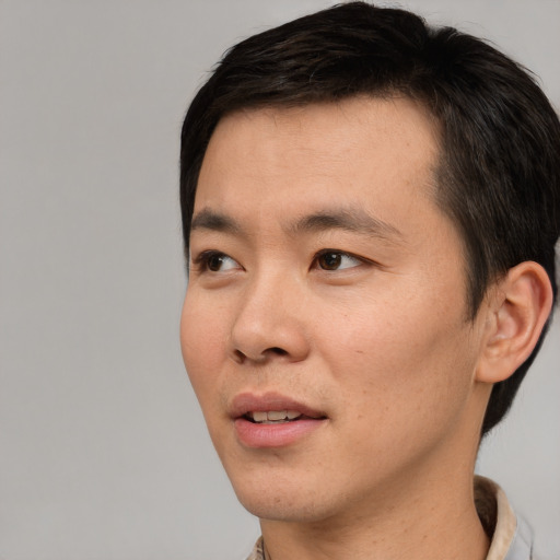 Neutral asian young-adult male with short  black hair and brown eyes