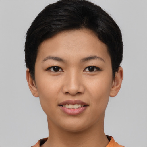 Joyful asian young-adult female with short  brown hair and brown eyes