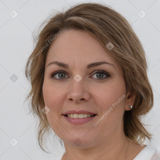 Joyful white young-adult female with medium  brown hair and green eyes