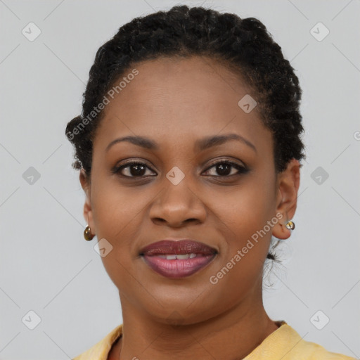 Joyful black young-adult female with short  brown hair and brown eyes