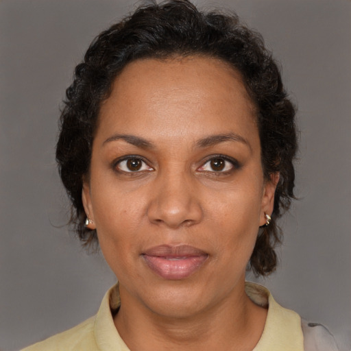 Neutral black adult female with short  brown hair and brown eyes