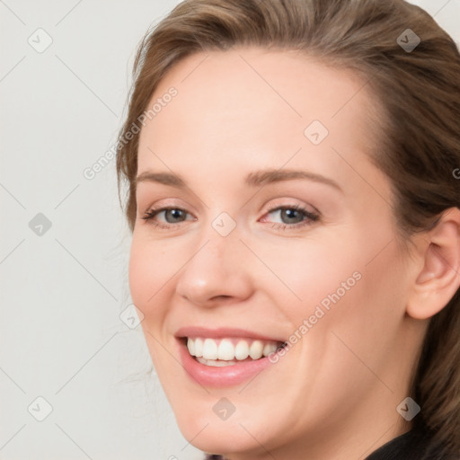 Joyful white young-adult female with medium  brown hair and blue eyes