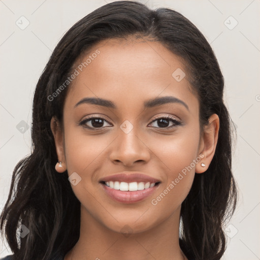 Joyful latino young-adult female with long  brown hair and brown eyes