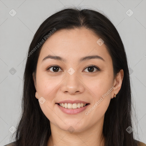 Joyful asian young-adult female with long  brown hair and brown eyes