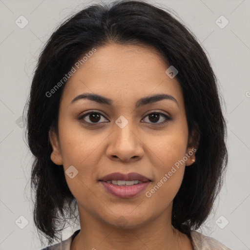 Joyful latino young-adult female with medium  brown hair and brown eyes