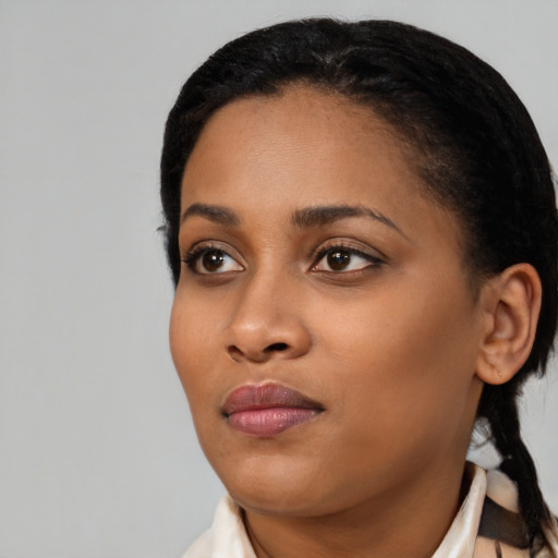 Neutral black young-adult female with medium  black hair and brown eyes