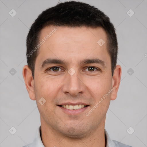 Joyful white young-adult male with short  brown hair and brown eyes