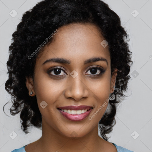 Joyful black young-adult female with long  black hair and brown eyes