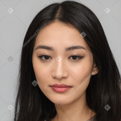 Joyful asian young-adult female with long  black hair and brown eyes