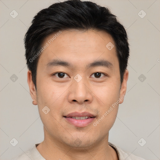 Joyful asian young-adult male with short  black hair and brown eyes