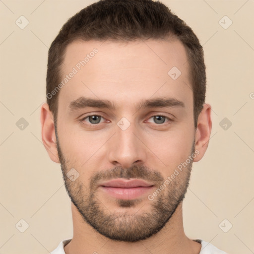 Joyful white young-adult male with short  brown hair and brown eyes