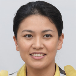 Joyful asian young-adult female with short  brown hair and brown eyes