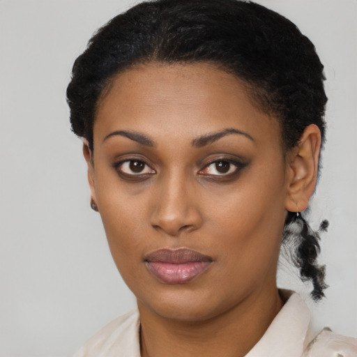Joyful latino young-adult female with short  black hair and brown eyes