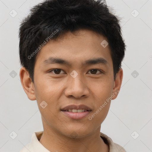 Joyful asian young-adult male with short  brown hair and brown eyes