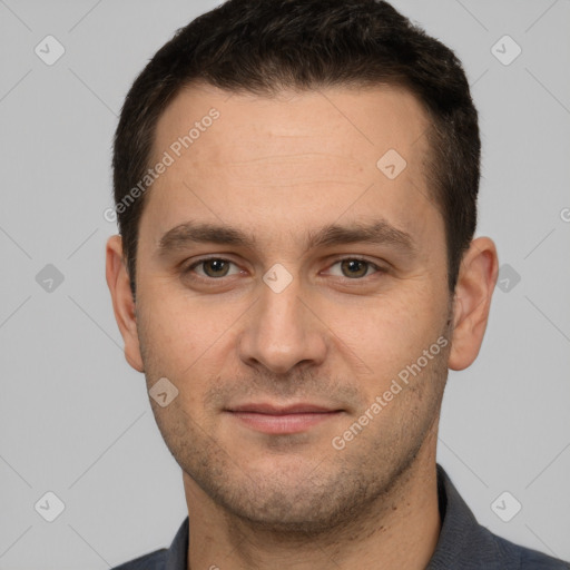 Joyful white young-adult male with short  brown hair and brown eyes