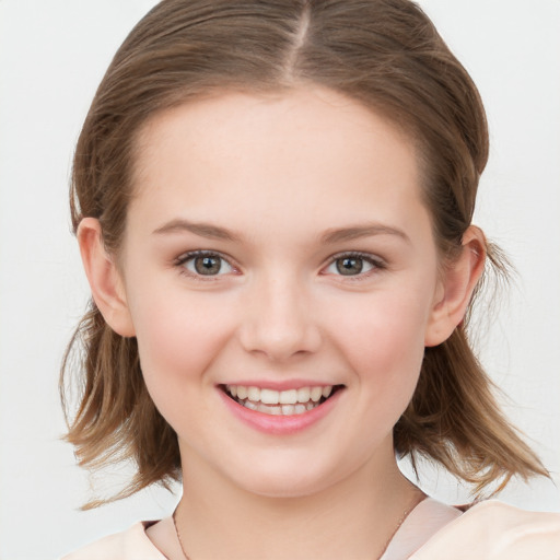 Joyful white child female with medium  brown hair and grey eyes