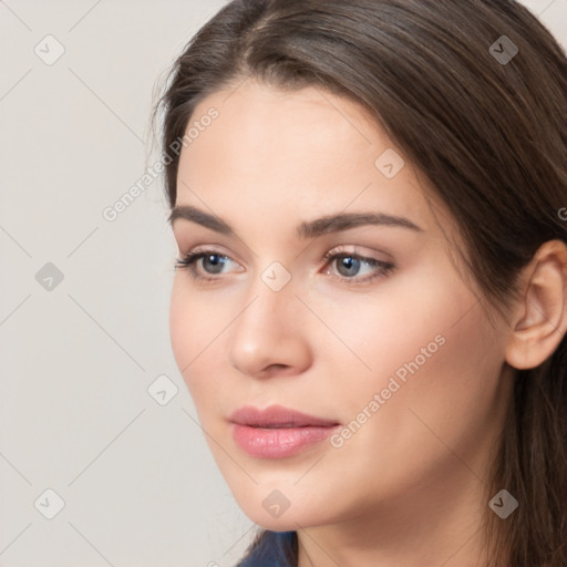 Neutral white young-adult female with long  brown hair and brown eyes