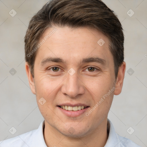 Joyful white adult male with short  brown hair and brown eyes