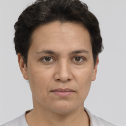 Joyful white adult female with short  brown hair and brown eyes