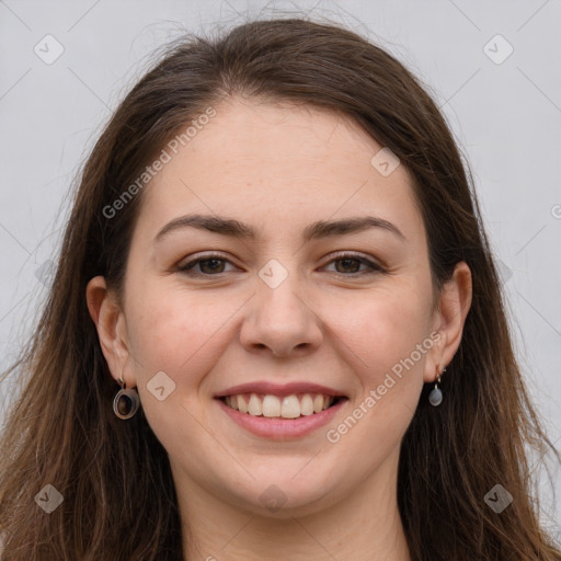 Joyful white young-adult female with long  brown hair and grey eyes