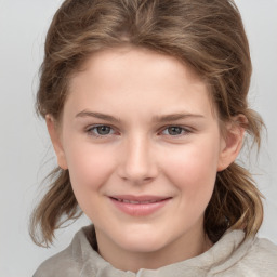 Joyful white child female with medium  brown hair and brown eyes