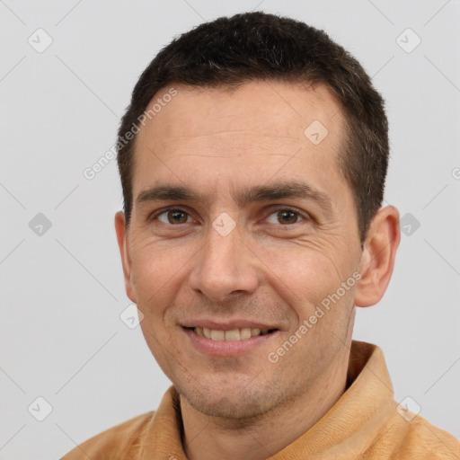 Joyful white adult male with short  brown hair and brown eyes