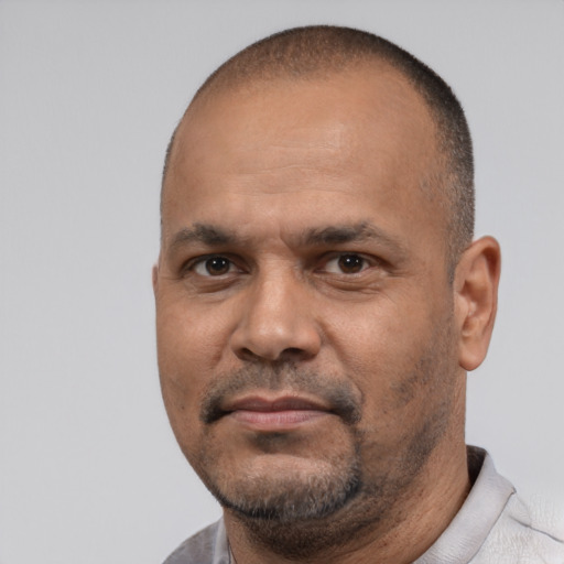 Neutral latino adult male with short  black hair and brown eyes