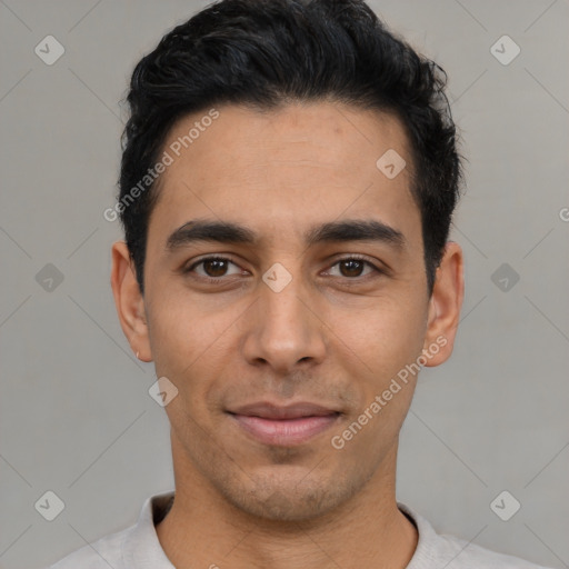 Joyful latino young-adult male with short  black hair and brown eyes