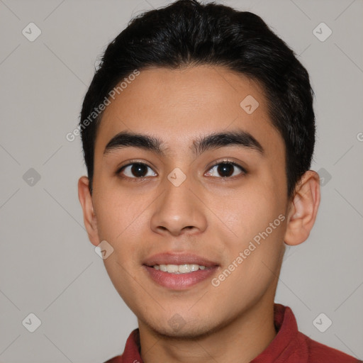 Joyful latino young-adult male with short  black hair and brown eyes