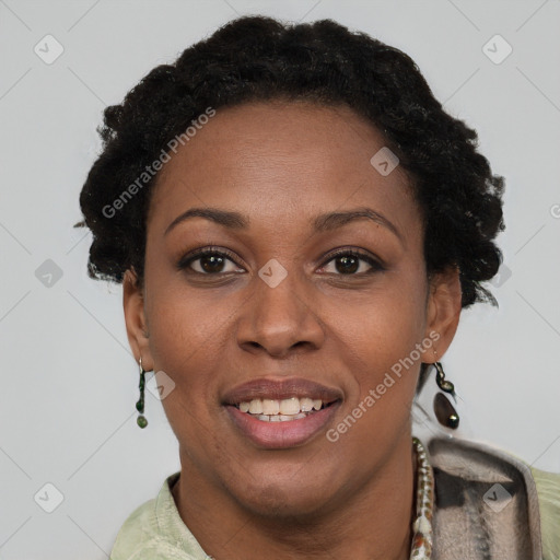 Joyful black adult female with short  brown hair and brown eyes