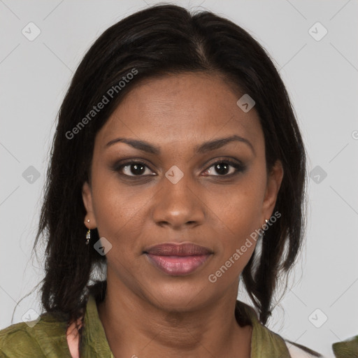 Joyful black young-adult female with long  brown hair and brown eyes