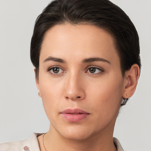 Neutral white young-adult female with short  brown hair and brown eyes