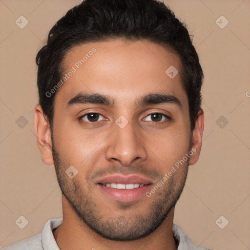 Joyful white young-adult male with short  black hair and brown eyes