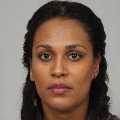 Neutral latino young-adult female with long  black hair and brown eyes