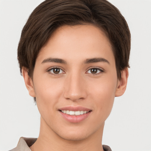 Joyful white young-adult female with short  brown hair and brown eyes