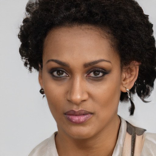 Neutral black young-adult female with short  brown hair and brown eyes