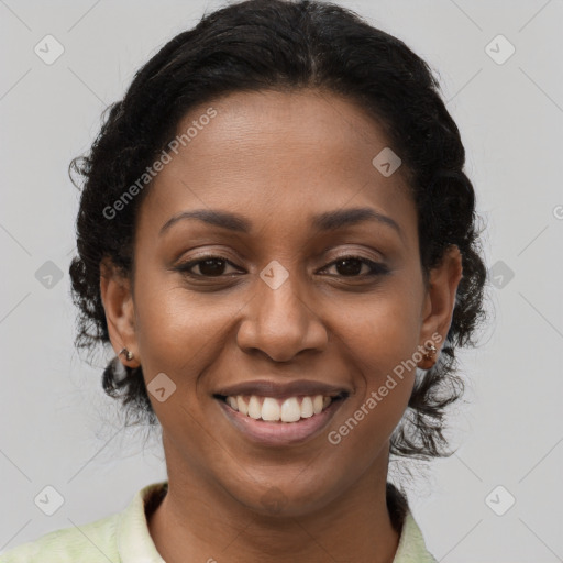 Joyful black young-adult female with medium  brown hair and brown eyes