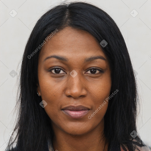 Joyful black young-adult female with long  black hair and brown eyes