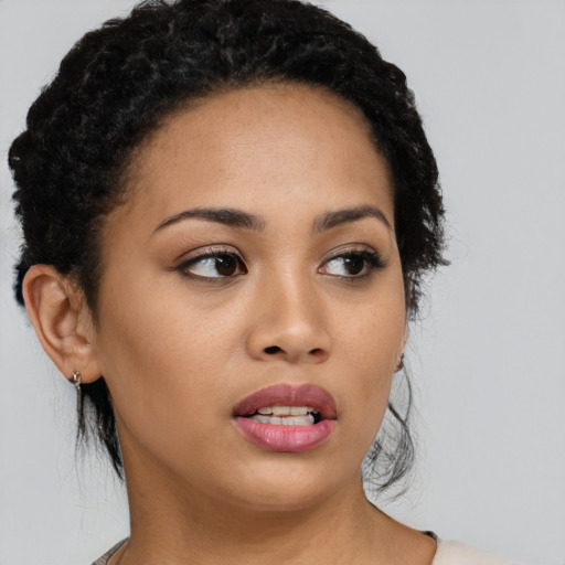 Neutral latino young-adult female with medium  black hair and brown eyes