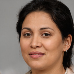 Joyful white adult female with medium  brown hair and brown eyes