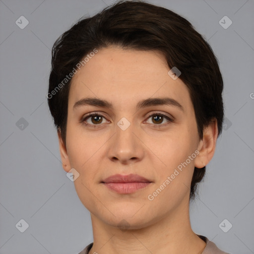 Joyful white young-adult female with short  brown hair and brown eyes