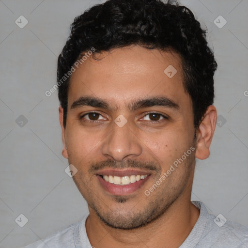 Joyful latino young-adult male with short  brown hair and brown eyes