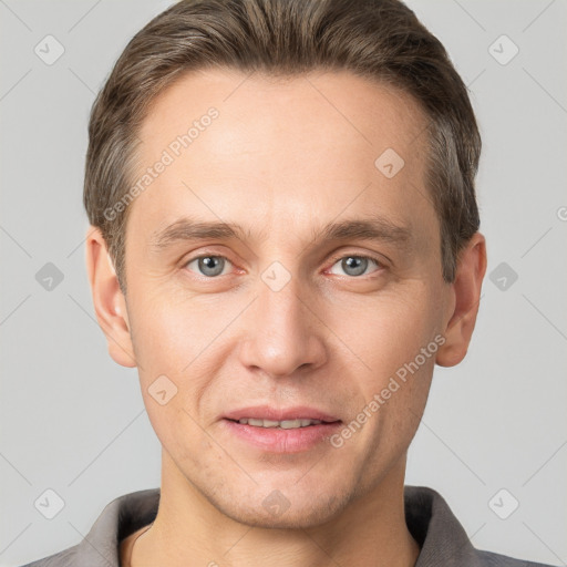 Joyful white adult male with short  brown hair and grey eyes