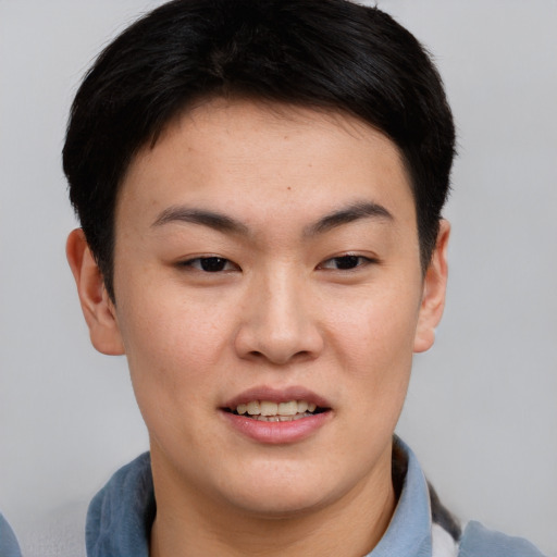 Joyful asian young-adult female with short  brown hair and brown eyes