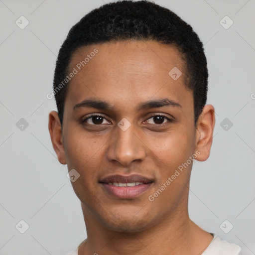 Joyful black young-adult male with short  black hair and brown eyes