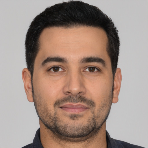 Neutral latino young-adult male with short  black hair and brown eyes