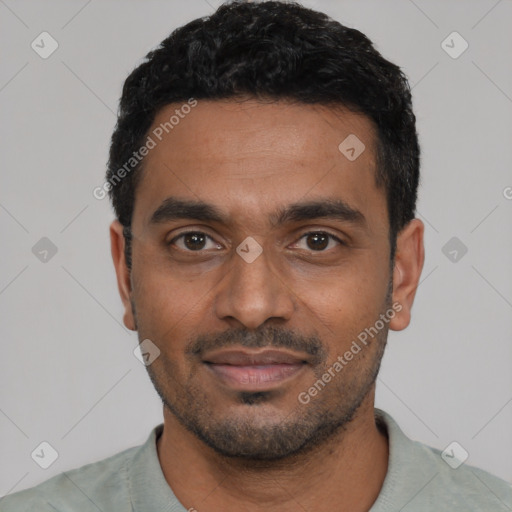 Joyful black young-adult male with short  black hair and brown eyes